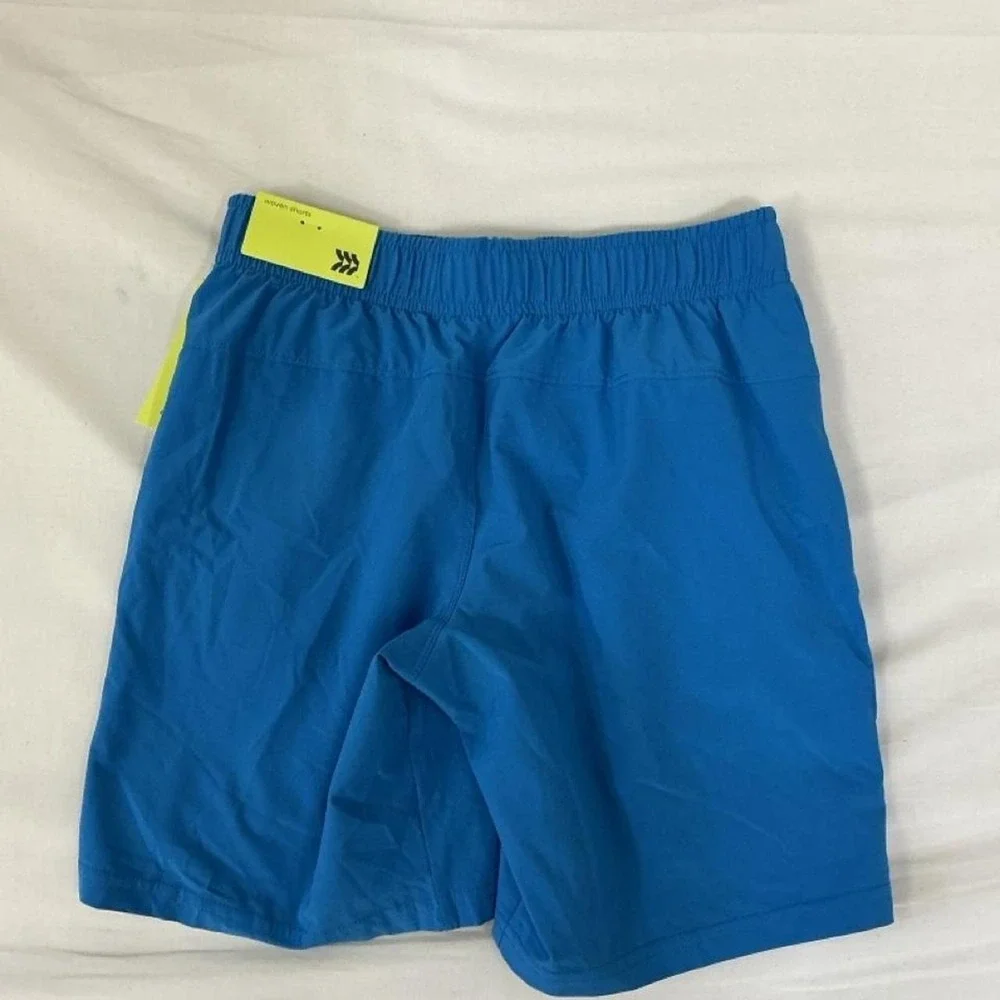 New with tags All in Motion boys active woven shorts in a bright blue color.